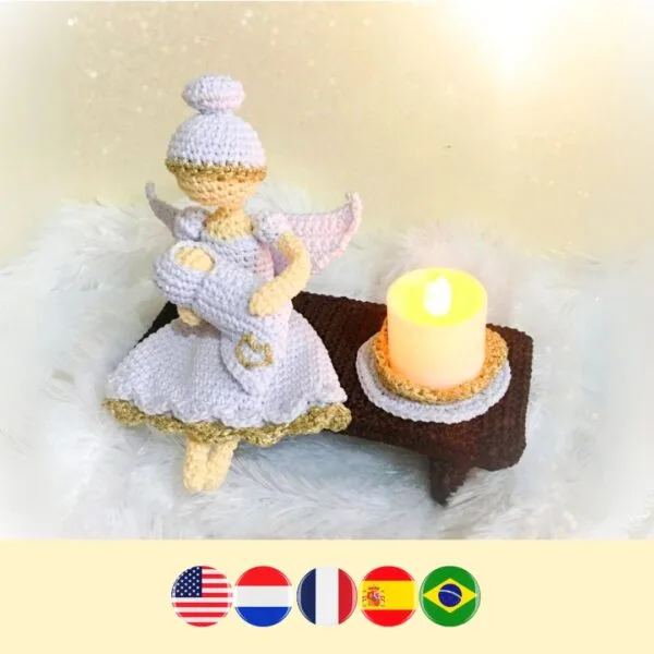 crochet angel and baby on crochet bench with LED candle