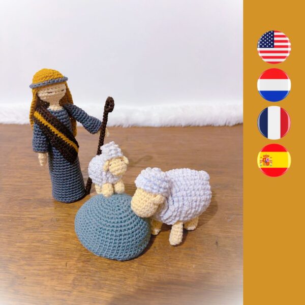 crochet shepherd with crochet sheep and crochet rock