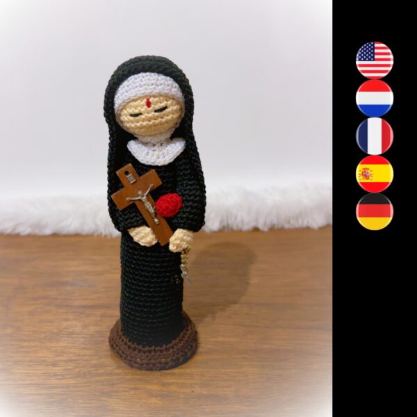 crochet doll of St Rita of Cascia with cross and rose