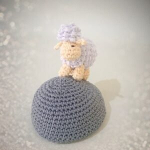 crochet sheep on rock