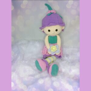 crochet doll holding flower
