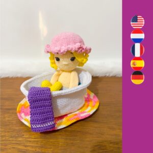 crochet doll in crochet bath with crochet towel and rug