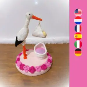 crochet stork with roses, crib and baby