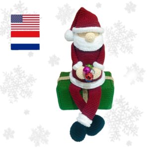 crochet Santa sitting on crochet gift box