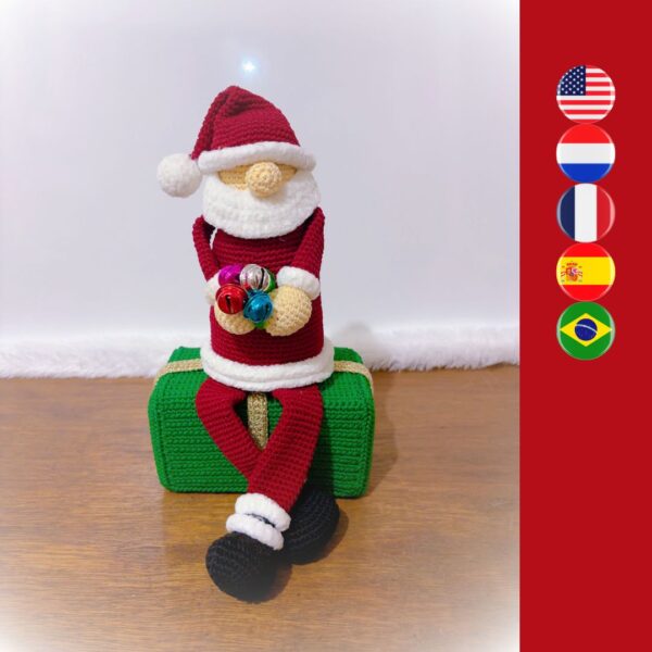 crochet Santa sitting on crochet gift