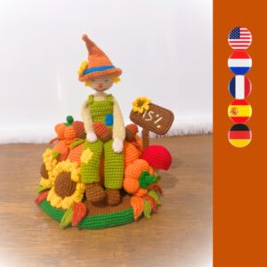 crochet scarecrow with crochet sunflowers, mushrooms, nuts, pumpkins, leafs