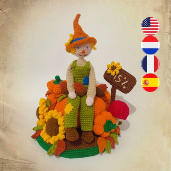 crochet scarecrow with crochet pumpkins, sunflowers, sign, leaves and a mushroom
