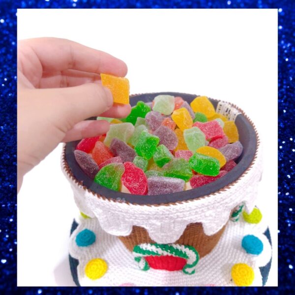 crochet gingerbread house filled with candy