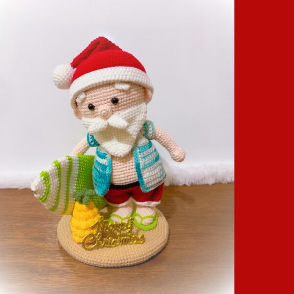 crochet tropical Santa with crochet surfboard and pineapple