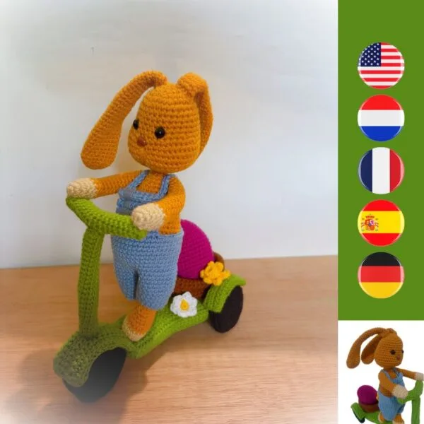 crochet Easter bunny on crochet scooter with a basket, Easter egg, daffodil and daisy