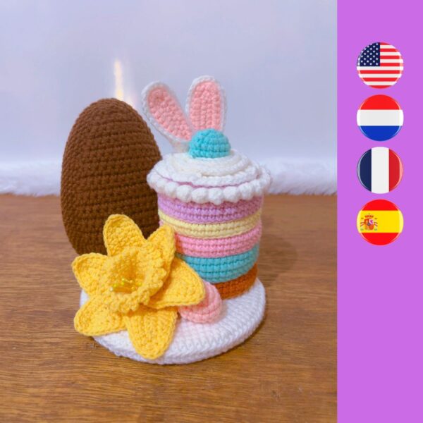 crochet pudding with Easter bunny ears, an Easter egg, candy and crochet daffodil