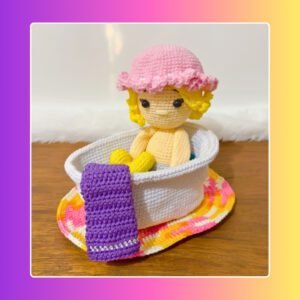 crochet doll in crochet bath with crochet towel and rug