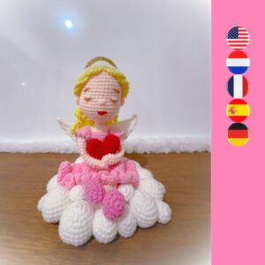 crochet angel sitting on crochet cloud