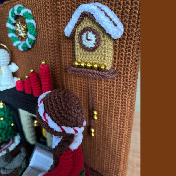 crochet lady doll in crochet living room with Christmas tree, cat, carpet, fireplace, cuckoo clock, Christmas wreath, candles