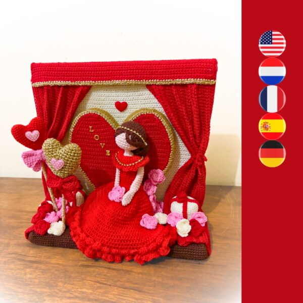 crochet lady in red dress in crochet Valentine setting with crochet hearts, roses, gift boxes and curtains