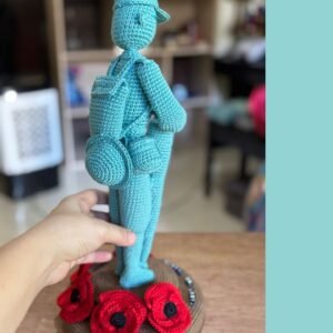 crochet soldier monument with poppies