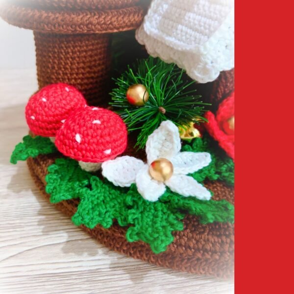 crochet Christmas candles with crochet poinsettia, gingerbread house, holly leaves and mushrooms